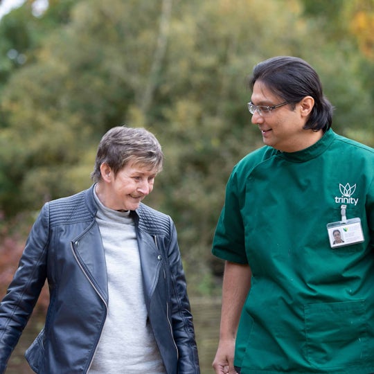 Elderly lady with a carer