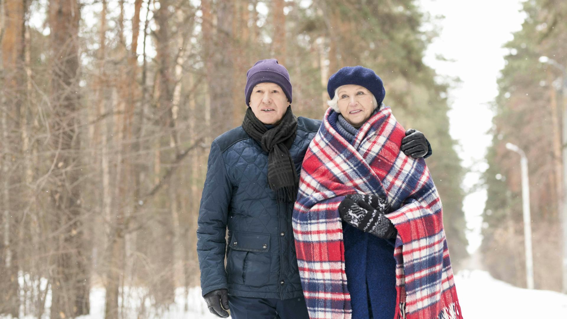 Couple wearing Warm Layers In The Snow