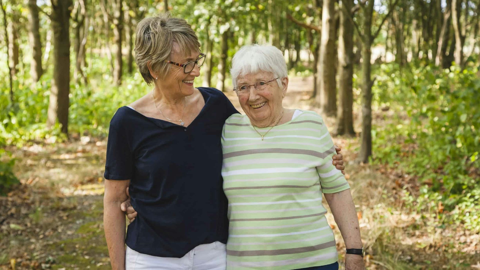 Elderly Ladies Walking In The Woods