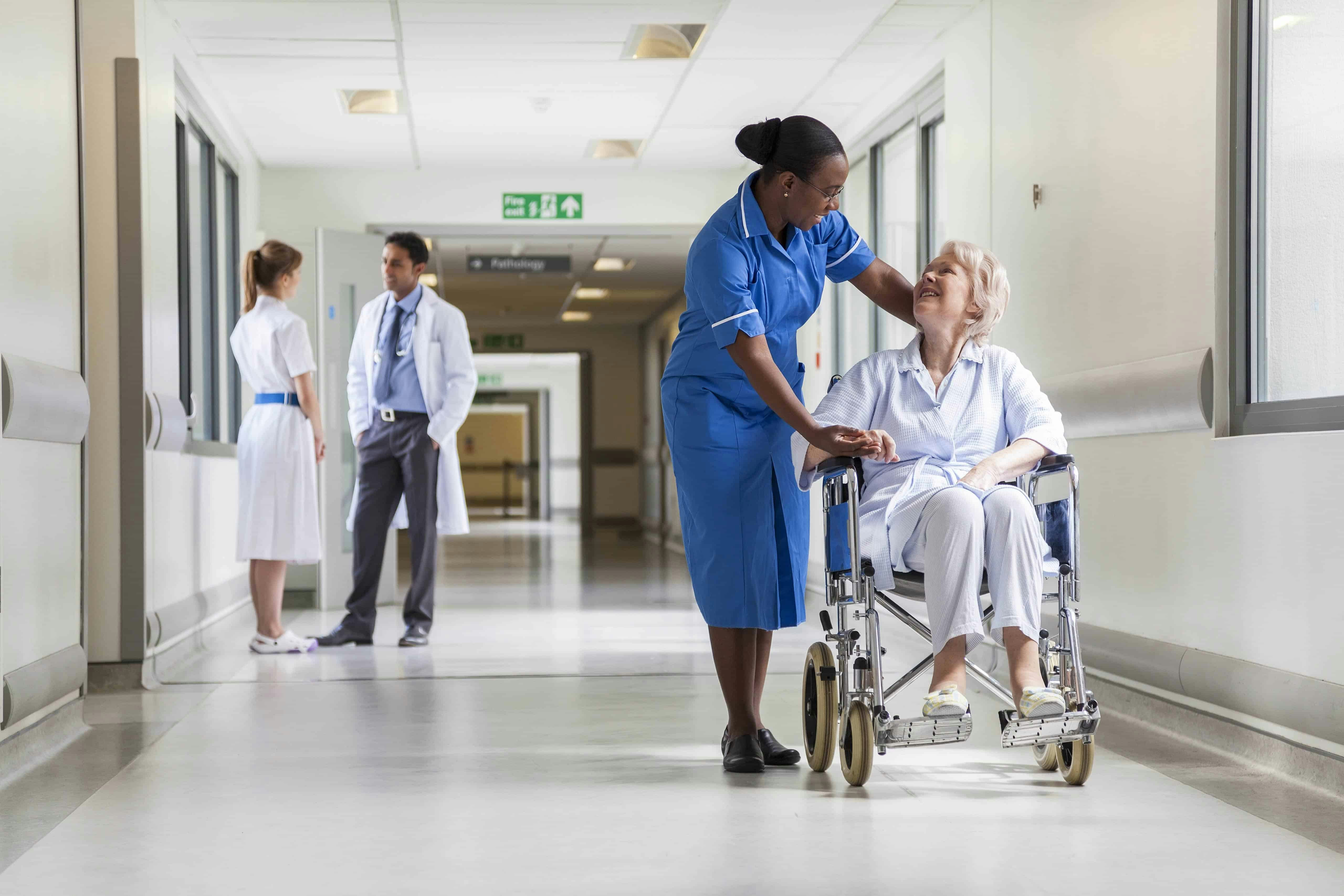 Nurse with elderly lady in a wheelchair