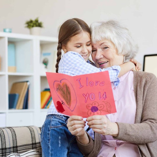 A Grandchild giving a heartfelt Valentine's Card to her Grandma
