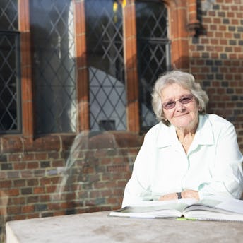 Elderly Lady reading a book