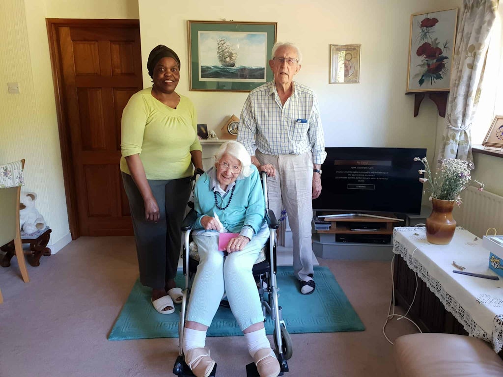 Pictured: TrinityCarer, Joana, with Pat and Dennis