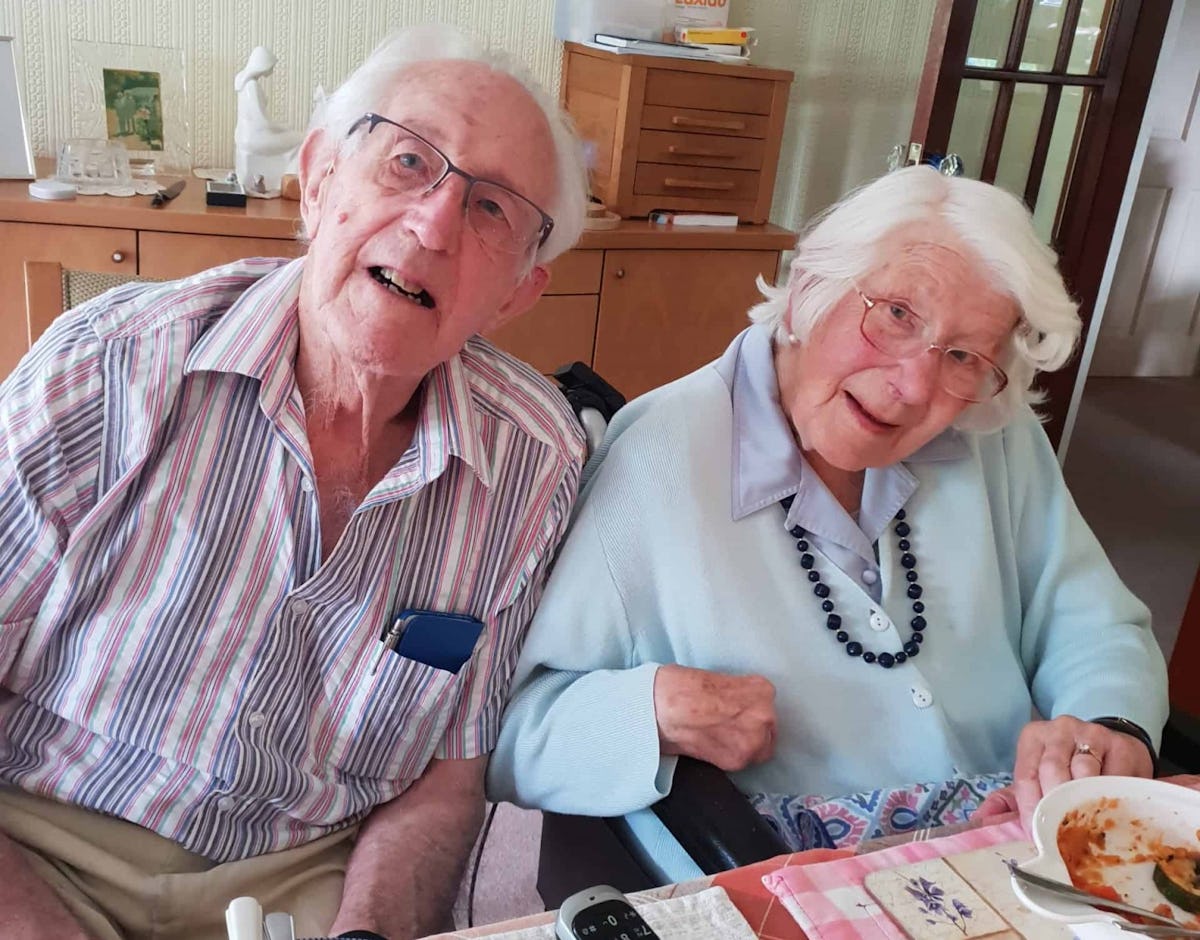 Pictured: Dennis and Pat having their 70th anniversary dinner date at home